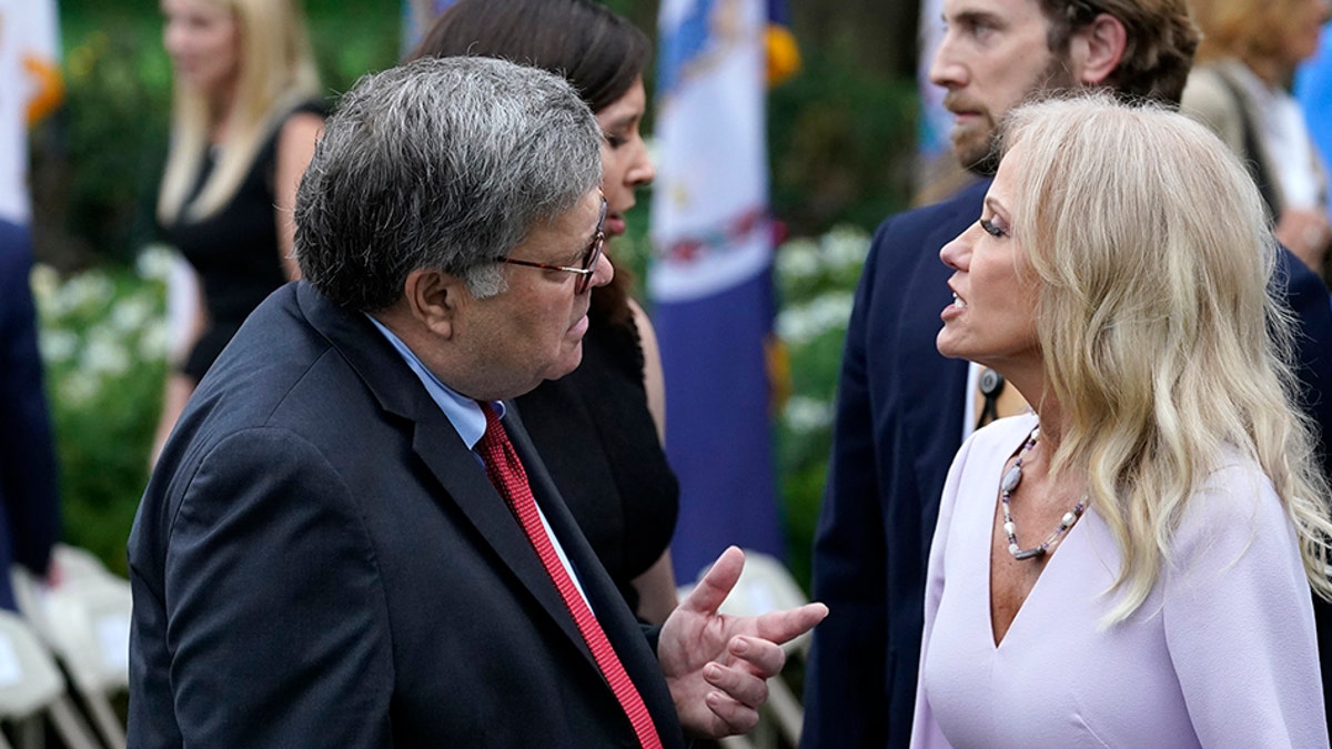 Attorney General William Barr speaks with Kellyanne Conway after President Donald Trump announced Judge Amy Coney Barrett as his nominee to the Supreme Court, in the Rose Garden at the White House, Saturday, Sept. 26, 2020, in Washington. (AP Photo/Alex Brandon)