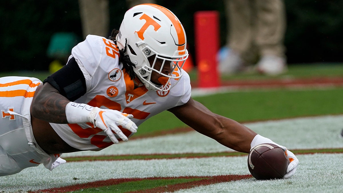 Tennessee linebacker Kivon Bennett (95) recovers a Georgia fumble in the end zone for a touchdown in the first half of an NCAA college football game Saturday, Oct. 10, 2020, in Athens, Ga. (AP Photo/John Bazemore)