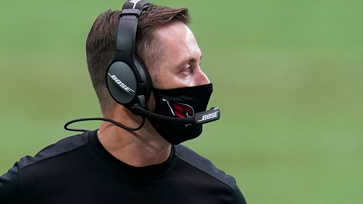 Arizona Cardinals head coach Kliff Kingsbury watches during the first half of an NFL football game against the Detroit Lions, Sunday, Sept. 27, 2020, in Glendale, Ariz. (AP Photo/Ross D. Franklin)