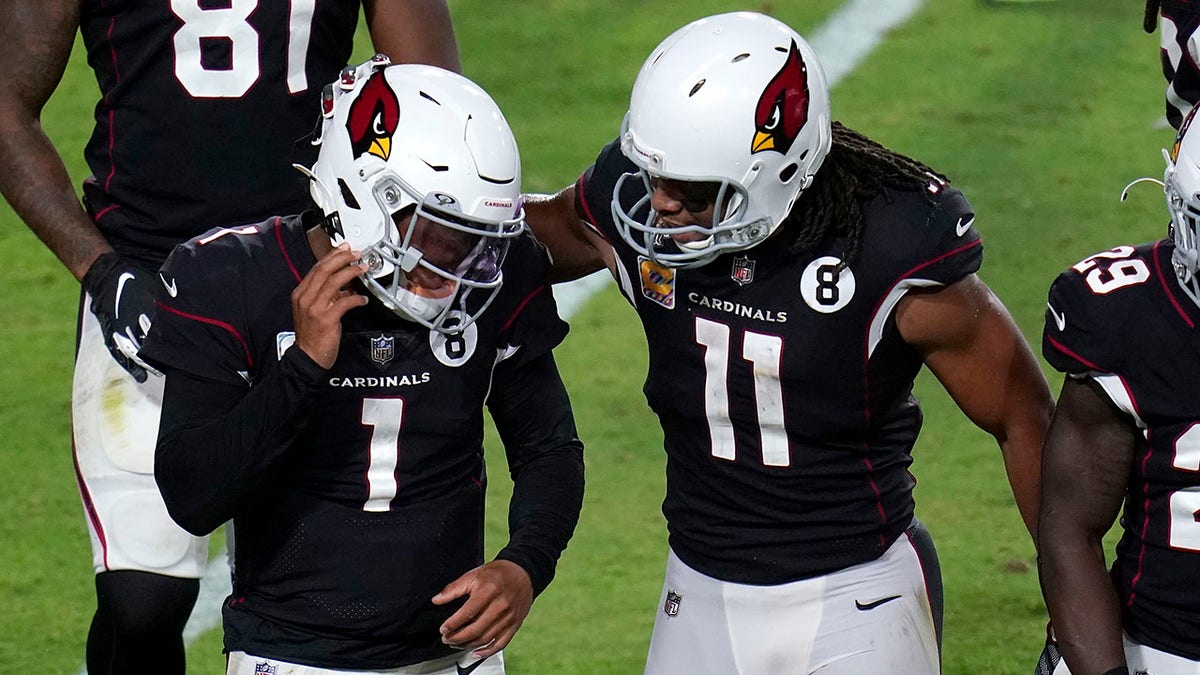 Arizona Cardinals quarterback Kyler Murray (1) celebrates his touchdown with wide receiver Larry Fitzgerald (11) during the second half of an NFL football game against the Seattle Seahawks, Sunday, Oct. 25, 2020, in Glendale, Ariz. (AP Photo/Ross D. Franklin)
