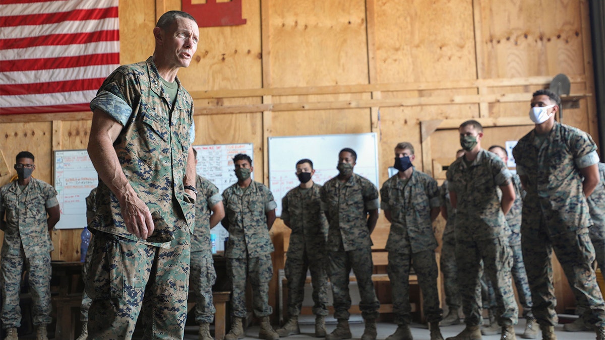 In this July 27, photo provided by the Defense Visual Information Distribution Service; DIVIDS, U.S. Marine Maj. Gen. Stephen M. Neary, Marine Forces Europe and Africa commander, left, speaks to Marines with Special Purpose Marine Air-Ground Task Force-Crisis Response-Africa 20.2, MARFOREUR/AF during a visit to Morόn Air Base, Spain.  (U.S. Marine Corps photo by Cpl. Tawanya Norwood via AP)