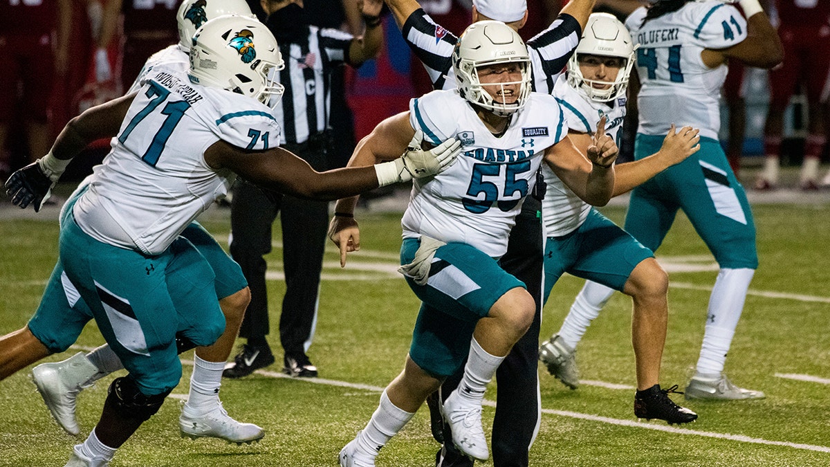 Coastal Carolina players celebrate after place kicker Massimo Biscardi (29) kicked the go-ahead and eventual game-winning field goal during the second half of an NCAA college football game against Louisiana-Lafayette in Lafayette, La., Wednesday, Oct. 14, 2020. (AP Photo/Paul Kieu)