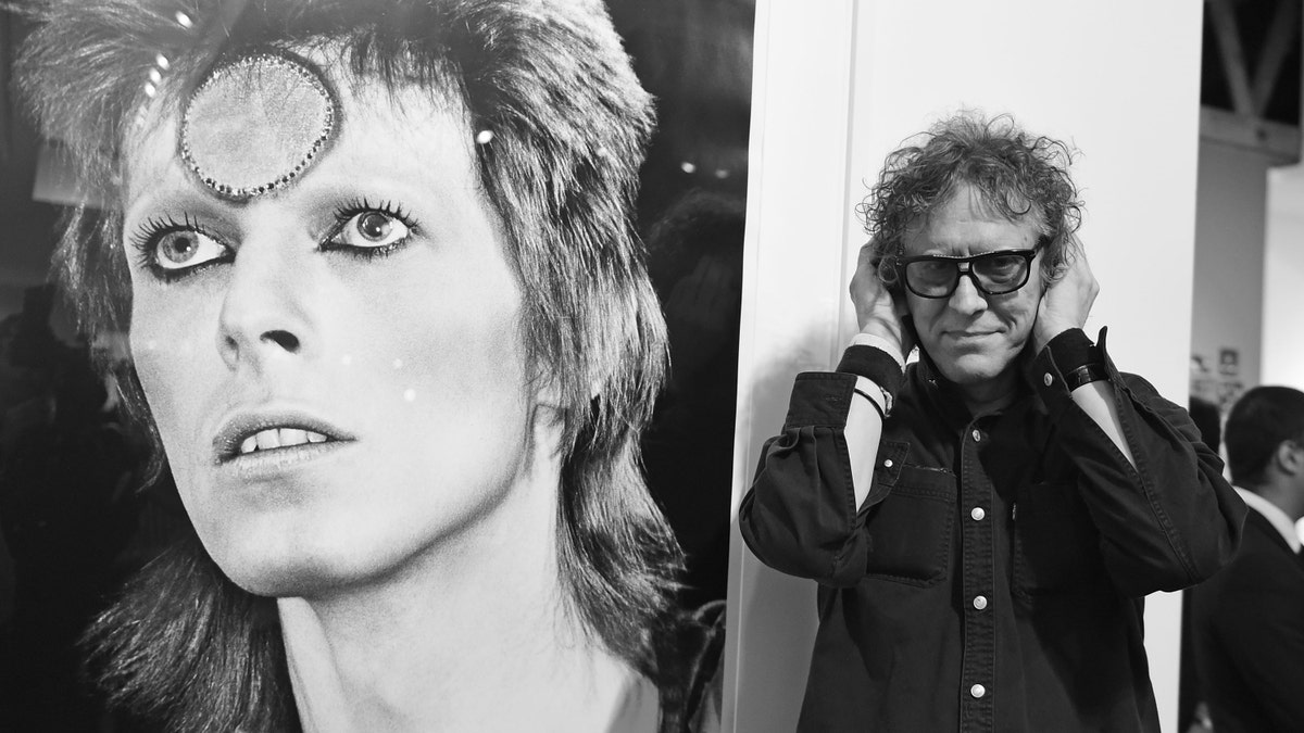 Photographer Mick Rock (right) spoke to Fox News about his time photographing David Bowie (left). (Angela Weiss/Getty Images)