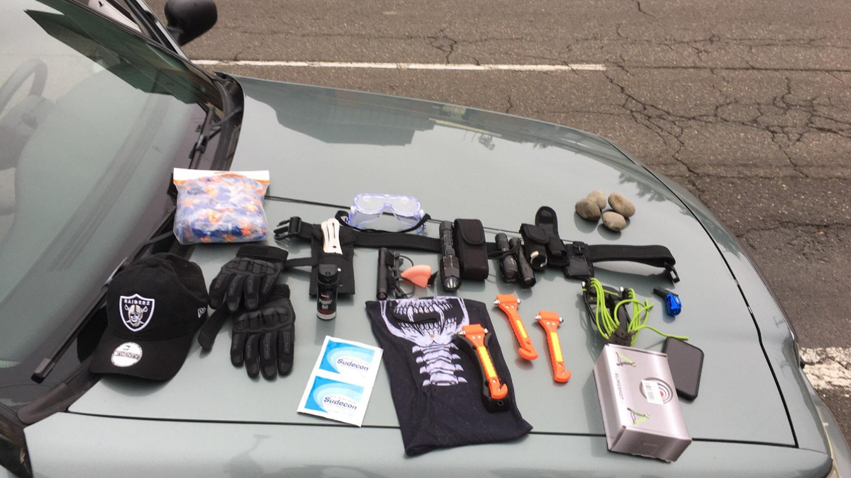 Police found window punch tools, pepper spray, throwing knives, a laser pointer, a slingshot, rocks, and other items, which were all seized as evidence.
