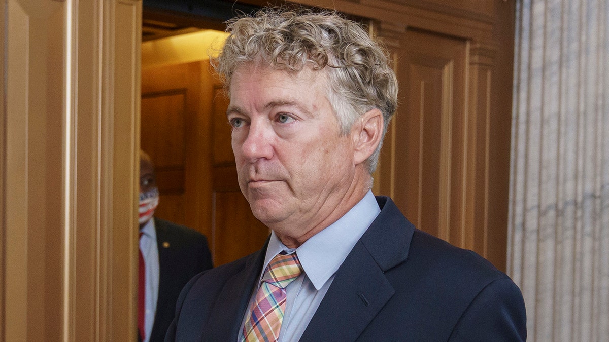 Sen. Rand Paul, R-Ky., arrives for votes during a rare weekend session to advance the confirmation of Judge Amy Coney Barrett to the Supreme Court, at the Capitol in Washington, Sunday, Oct. 25, 2020. (AP Photo/J. Scott Applewhite)
