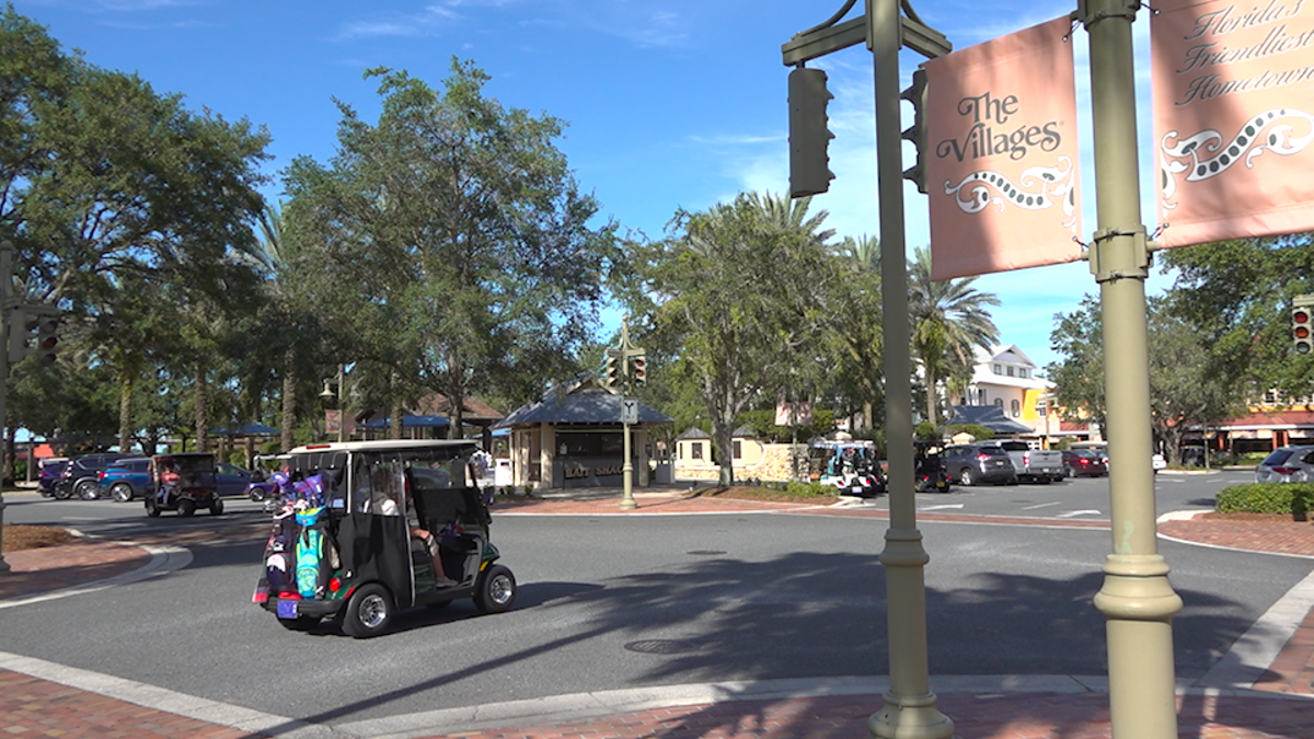 Golf carts zip around Lake Sumter Landing in The Villages (Robert Sherman, Fox News).