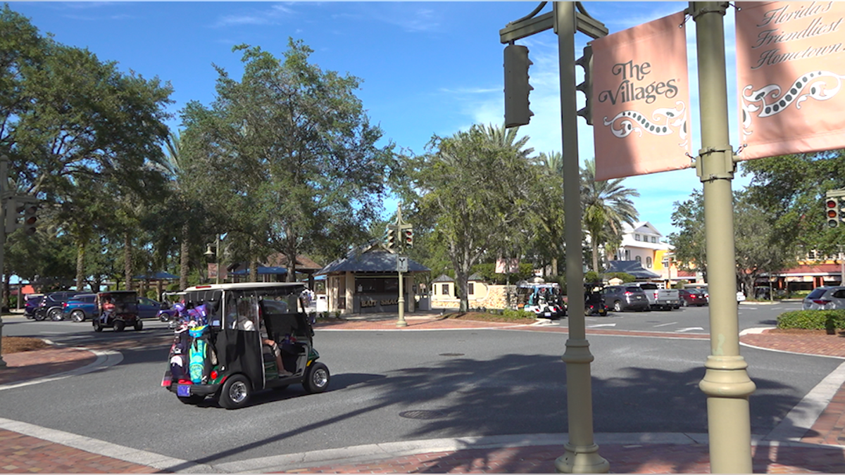 Golf carts zip around Lake Sumter Landing in The Villages (Robert Sherman, Fox News).
