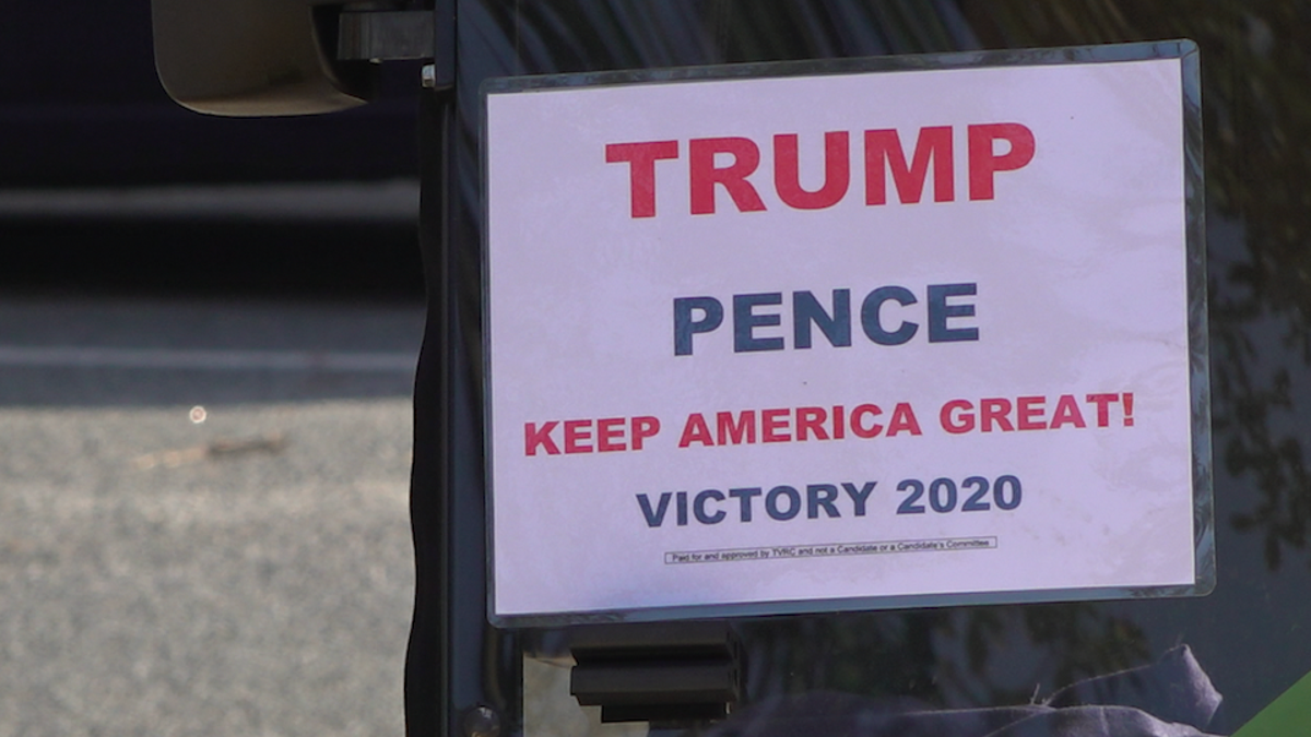 A sign expressing support for President Trump hanging from the front of a golf cart in The Villages (Robert Sherman, Fox News)