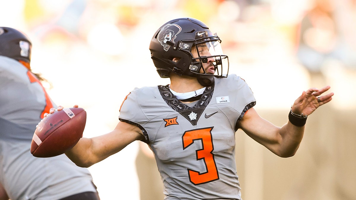 Oklahoma State quarterback Spencer Sanders (3) throws a pass during an NCAA college football game Saturday, Oct. 24, 2020, in Stillwater, Okla. (AP Photo/Brody Schmidt)