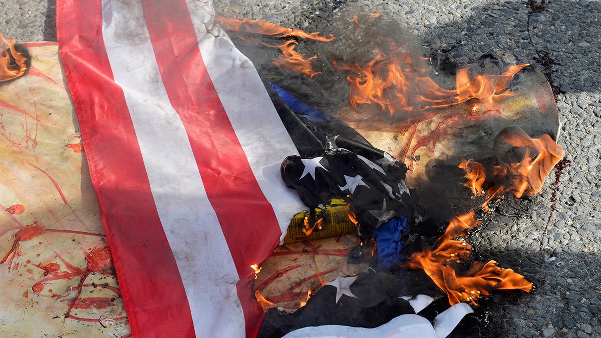 Counter protesters Burning US flag in Boston Massachusetts 