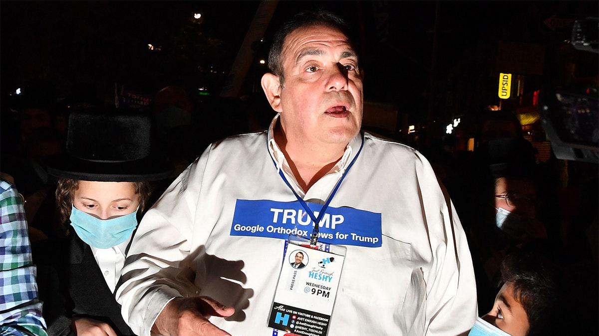 Harold Tischler gathers with members of the Orthodox Jewish community who support President Trump during a protest over new coronavirus restrictions. (Stephen Lovekin/Shutterstock)