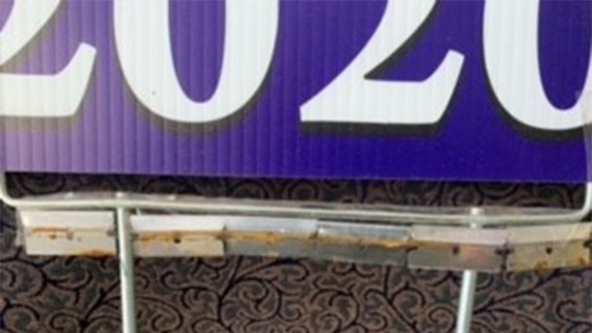 Razorblades lined the bottom of the political sign - Courtesy of Oakland County Sheriff's Office