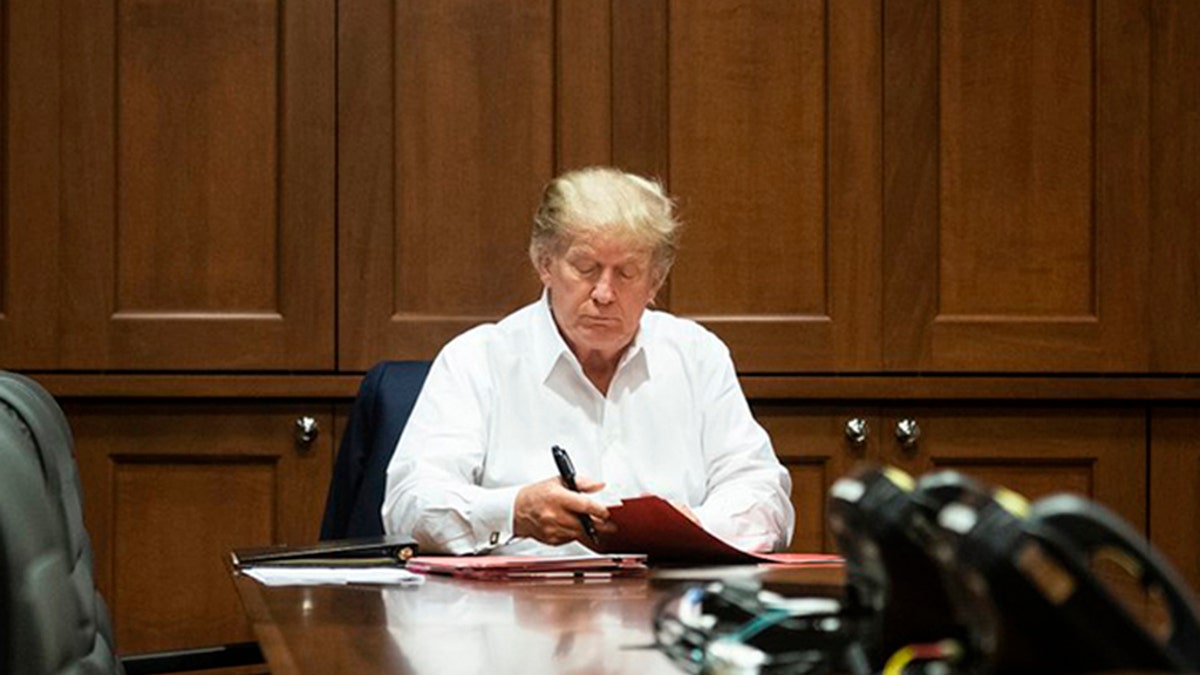 President Trump works inside Walter Reed National Military Medical Center in Bethesda, Md., where he has been receiving treatment for the coronavirus. (White House photo)<br>