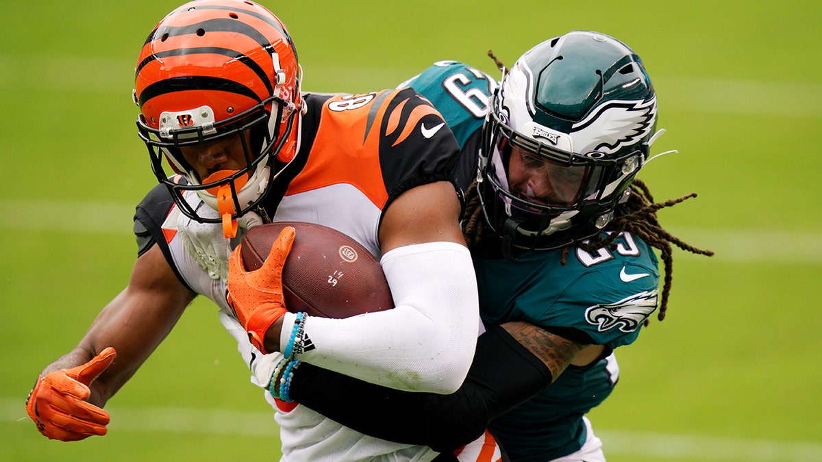 Cincinnati Bengals' Tyler Boyd, left, is tackled by Philadelphia Eagles' Avonte Maddox during the second half of an NFL football game, Sunday, Sept. 27, 2020, in Philadelphia. (AP Photo/Chris Szagola)