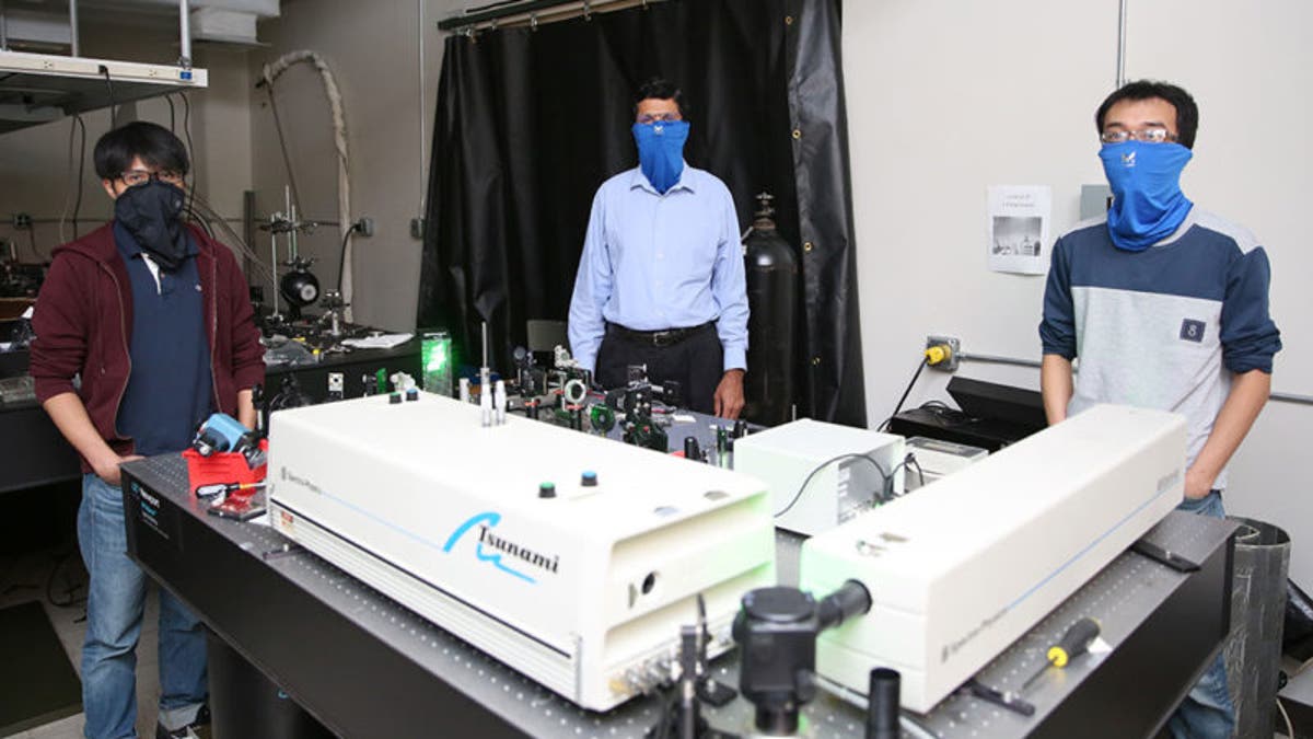 A team of researchers at the University of Georgia conducts a study on neck gaiters and efficacy in reducing the spread of respiratory droplets. Pictured center is Suraj Sharma, lead study author and professor in the College of Family and Consumer Sciences. (Photo courtesy of University of Georgia)