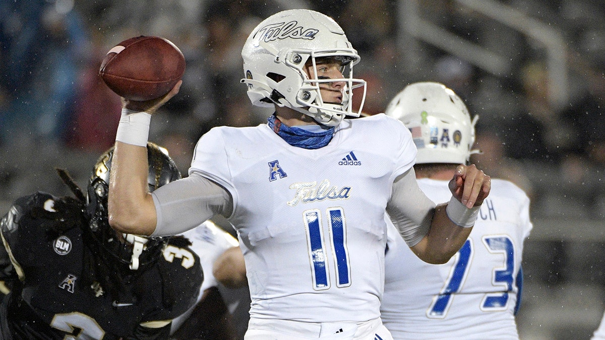 Tulsa quarterback Zach Smith (11) throws a pass in front of Central Florida defensive back Antwan Collier (3) during the first half of an NCAA college football game Saturday, Oct. 3, 2020, in Orlando, Fla. (AP Photo/Phelan M. Ebenhack)