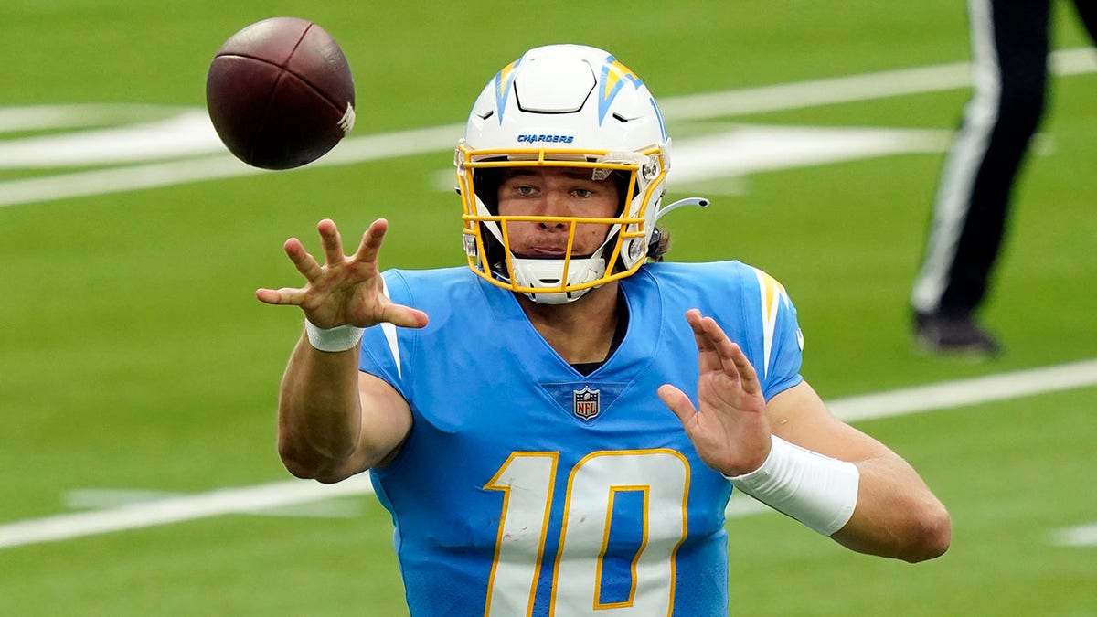 Los Angeles Chargers quarterback Justin Herbert pitches the ball during the first half of an NFL football game against the Jacksonville Jaguars Sunday, Oct. 25, 2020, in Inglewood, Calif. (AP Photo/Alex Gallardo)
