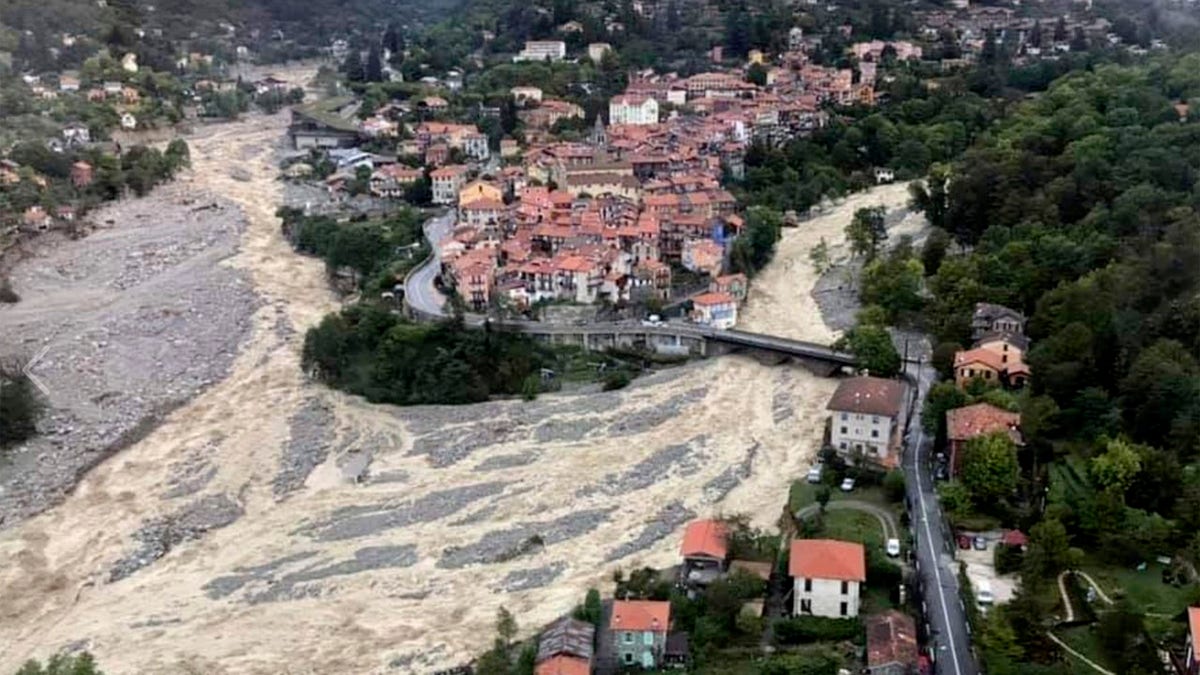 This aerial view provided Sunday Oct.4, 2020 by the Alpes Maritimes region fire brigade show a house keeping a fragile balance on a hill while a rive floods Saturday Oct.3. 2020 near La Vesubie, southern France.