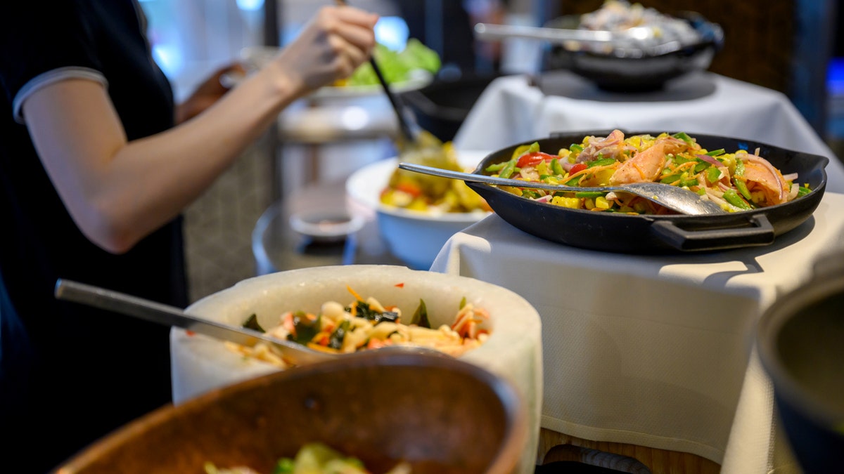 Family-style dinners, which involve guests passing platters of food around the table, should be avoided this Thanksgiving, Dr. Erika Schwartz says.