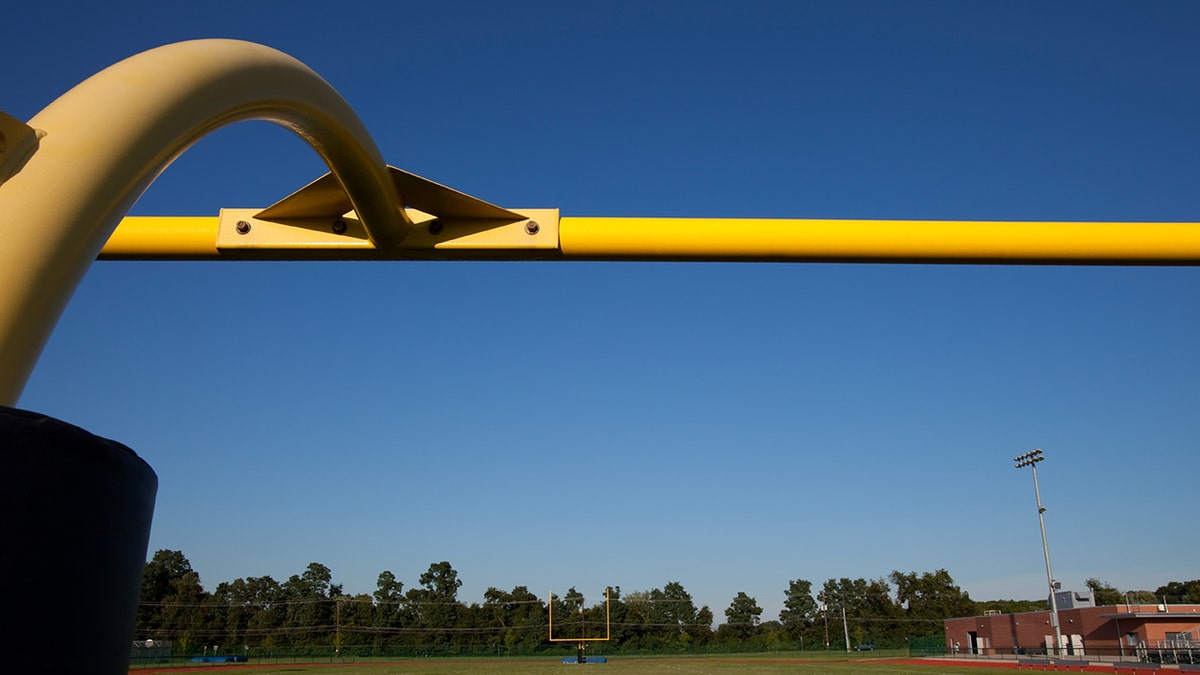 View of high school football field goal posts