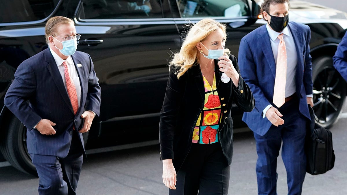 Mark and Patricia McCloskey arrive for a court hearing along with their attorney, Joel Schwartz, right, on Wednesday in St. Louis. (AP Photo/Jeff Roberson)
