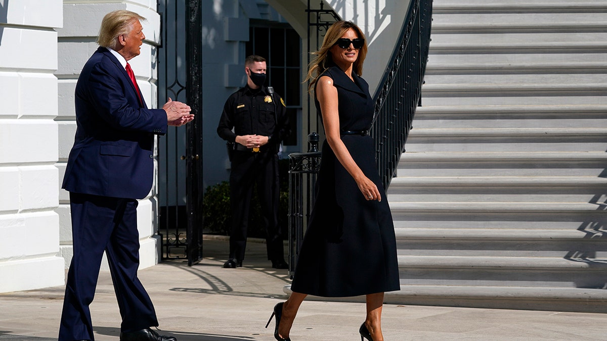 President Donald Trump and first lady Melania Trump walk to board Marine One on the South Lawn of the White House, Thursday, Oct. 22, 2020, in Washington. Trump is headed to Nashville, Tenn., for a debate. (AP Photo/Alex Brandon)