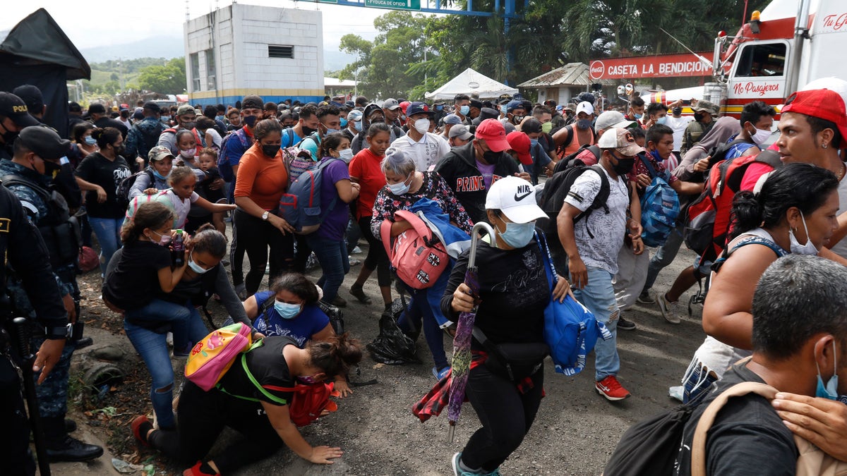 At the Honduras-Guatemala border, the migrants pushed past outnumbered Guatemalan police and soldiers who made little attempt to stop them. (AP)