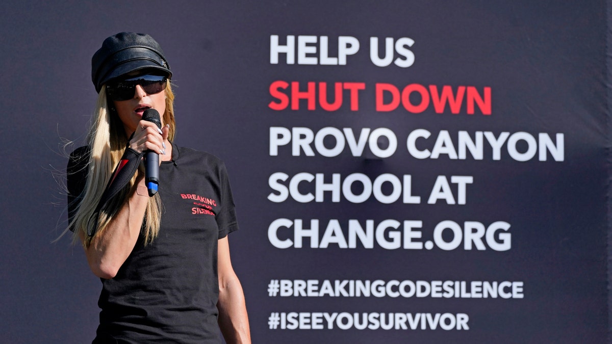 Paris Hilton speaks before leading a protest Friday, Oct. 9, 2020, in Provo, Utah. Hilton was in Utah Friday to lead a protest outside a boarding school where she alleges she was abused physically and mentally by staff when she was a teenager. Hilton, now 39, went public with the allegations in a new documentary and wants a school that she says left her with nightmares and insomnia for years to be shut down.