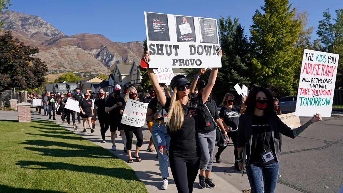 Paris Hilton, center, leads a protest Friday, Oct. 9, 2020, in Provo, Utah.