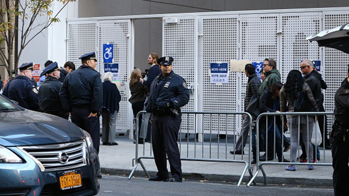 New York police take security measures as Republican presidential nominee Donald Trump arrives to vote at the Beckman Hill International School in New York City on Nov. 8, 2016. (Photo by Volkan Furuncu/Anadolu Agency/Getty Images)