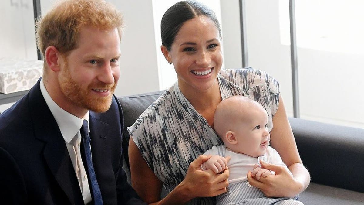 Harry and Meghan sit with their son Archie