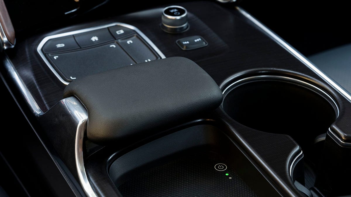 Acura's True Touchpad interface features a padded rest for your hand that's mounted ahead of a wireless smartphone charging pad.