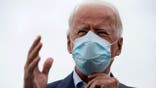 Democratic presidential candidate former Vice President Joe Biden speaks with members of the media before boarding his campaign plane at New Castle Airport, Saturday, Oct. 10, 2020, in New Castle, Del., en route to Erie, Pa. (AP Photo/Carolyn Kaster)