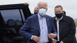 Democratic presidential candidate former Vice President Joe Biden exits his motorcade to board his campaign plane at New Castle Airport, in New Castle, Del., Monday, Oct. 12, 2020, en route to Ohio. (AP Photo/Carolyn Kaster)