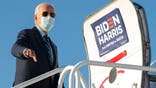 Democratic presidential candidate former Vice President Joe Biden boards his campaign plane at Raleigh-Durham International Airport in Morrisville, N.C., Sunday, Oct. 18, 2020, en route to Wilmington, Del. (AP Photo/Carolyn Kaster)