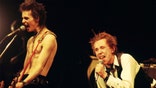 UNITED STATES - JANUARY 05: Photo of SEX PISTOLS; Sid Vicious & Johnny Rotten (John Lydon) performing live onstage at The Great South East Music Hall & Emporium, on final tour