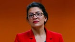 U.S. Rep. Rashida Tlaib, D-Mich., listens to a constituent in Wixom, Mich., Thursday, Aug. 15, 2019. (AP Photo/Paul Sancya)