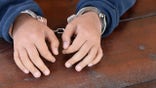 Man in handcuffs (iStock)