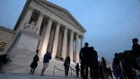 Mourners pay respects as Justice Ruth Bader Ginsburg lies in repose under the Portico at the top of the front steps of the U.S. Supreme Court building on Thursday, Sept. 24, 2020, in Washington. Ginsburg, 87, died of cancer on Sept. 18. (AP Photo/Jose Luis Magana)
