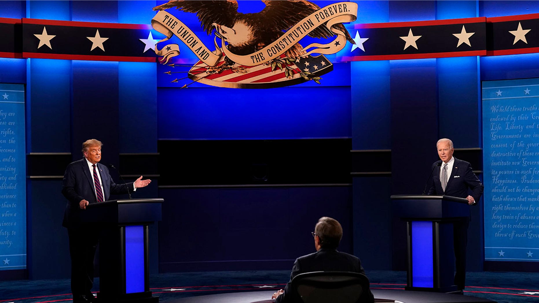 Moderator Chris Wallace of Fox News listens as President Donald Trump and Democratic candidate former Vice President Joe Biden participate in the first presidential debate Tuesday, Sept. 29, 2020, at Case Western University and Cleveland Clinic, in Cleveland, Ohio. (AP Photo/Patrick Semansky)