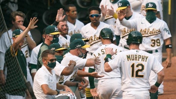 Pinder delivers timely hit, A's advance in playoffs at last