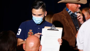 Arizona election officials scramble after judge extends voter registration deadline