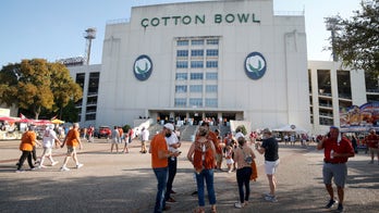No fair, few fans: Texas, OU play on despite different feel