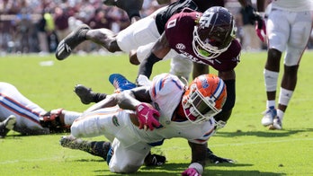 Texas A&M's Bobby Brown injures knee while celebrating sack vs. Florida