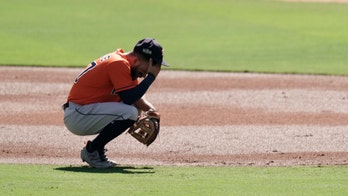 Altuve's 2 early throwing errors doom Astros in ALCS Game 2