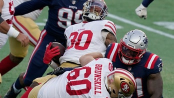 Wilson has 3 TDs before injury, 49ers crush Patriots 33-6