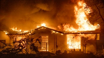 PG&E charged in California wildfire that killed four and destroyed hundreds of homes