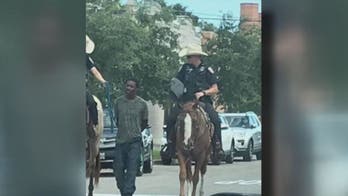 Texas man seeks $1M after viral photo shows mounted officers leading him by rope