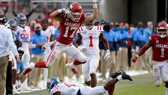 Arkansas forces seven turnovers, beats Ole Miss 33-21