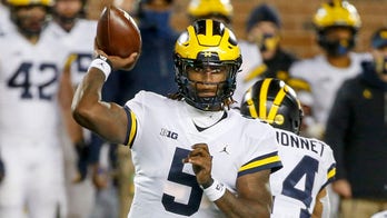 No. 18 Michigan tops No. 21 Minnesota 49-24 in Milton debut